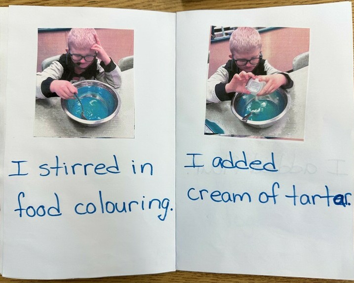 Photo of the student's book showing him making play doh. On the left he stirs in food colouring On the right he adds cream of tarter. The text is beneath the photos